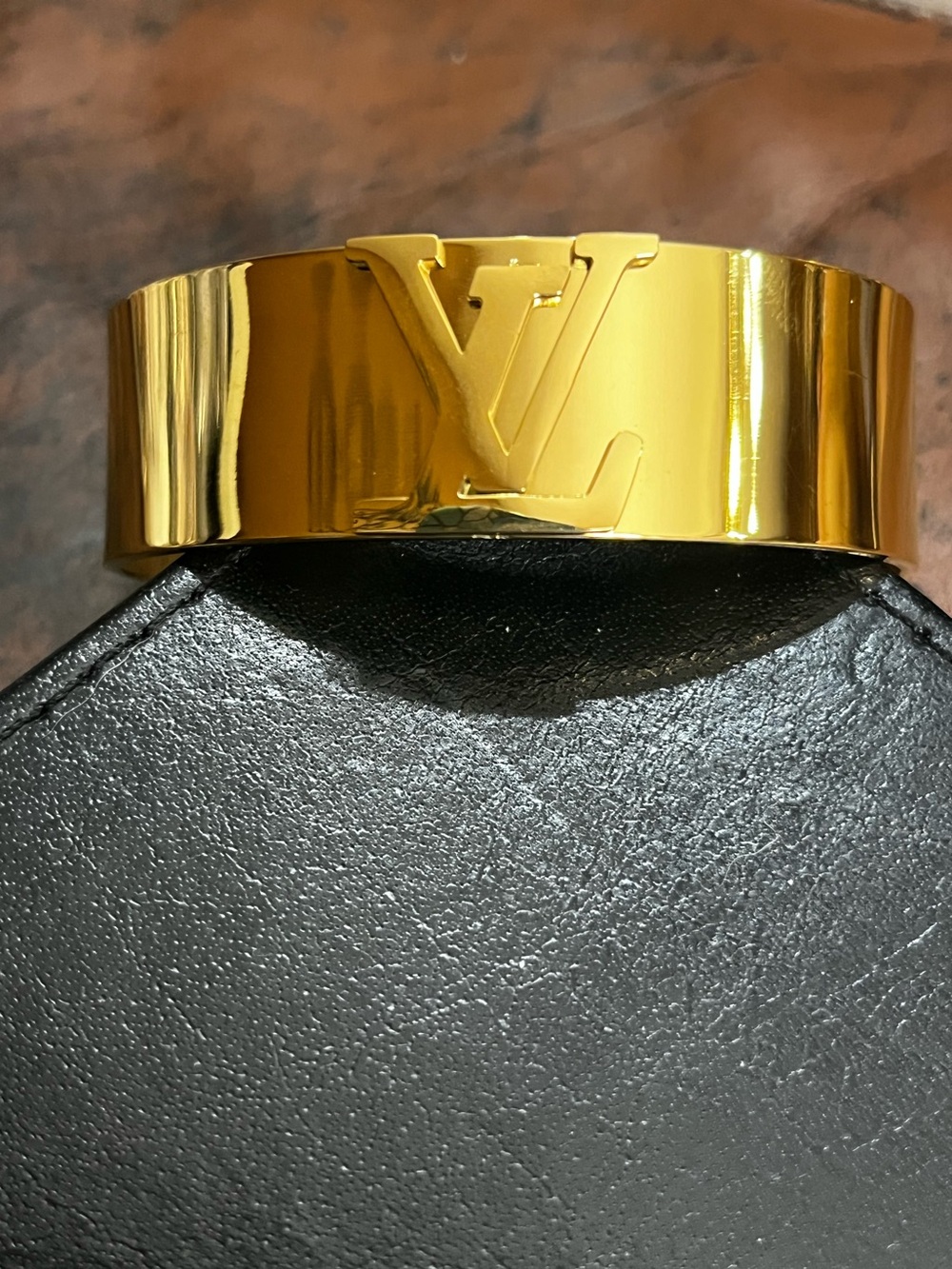 Louis. Vuitton. Gold Tone Signature Logo Cuff Style Bracelet
